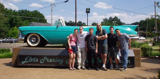 All of us in front of the car museum sign