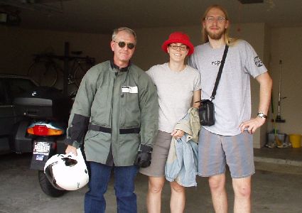 Jeff, April, and Shawn next to Jeff's bike